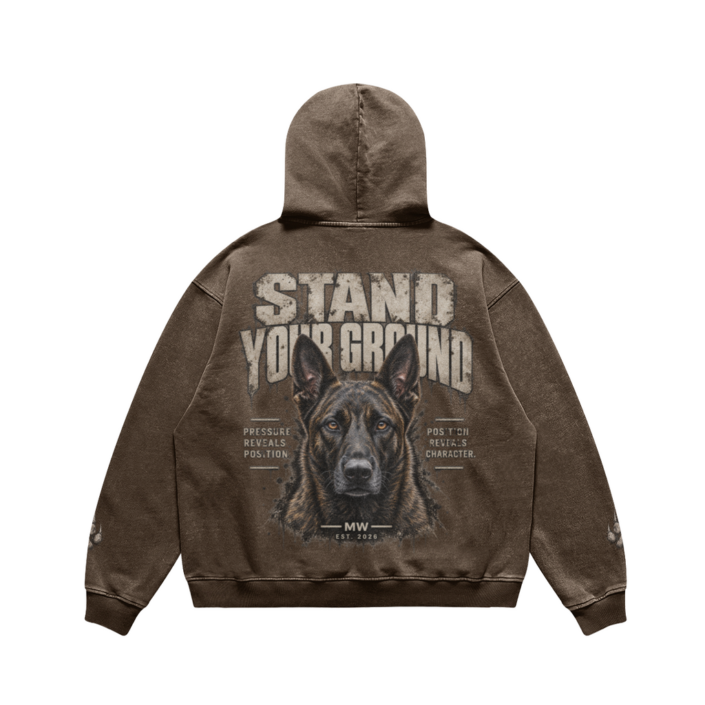 A brown acid-wash hoodie shown from the back, featuring a large graphic print of a German Shepherd dog's face with the text 'STAND YOUR GROUND' and smaller text reading 'PRESS LE REVOLVERS POLICE' and 'POLICE REVOLVERS CHARACTER'.